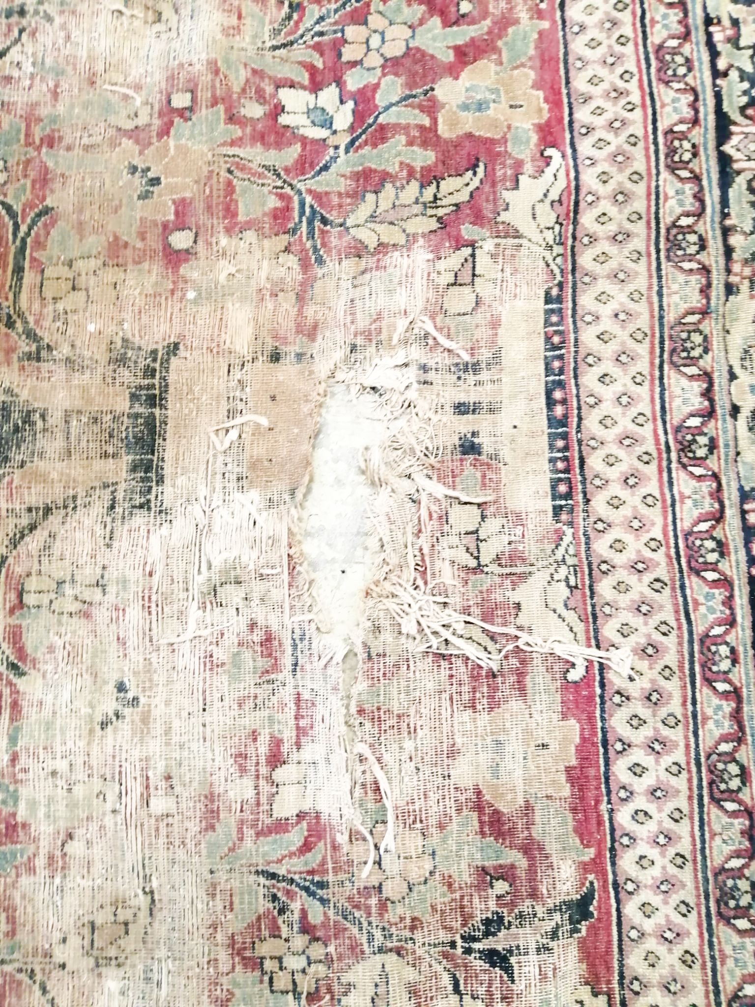 An antique Kashan blue ground carpet (worn and holed) 410 x 300cm